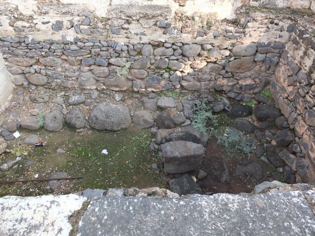 a stone wall with a stone wall and a stone wall