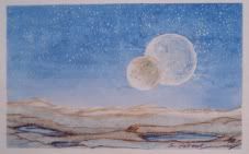 Two Moons Two moons in the sky over a desert landscape.